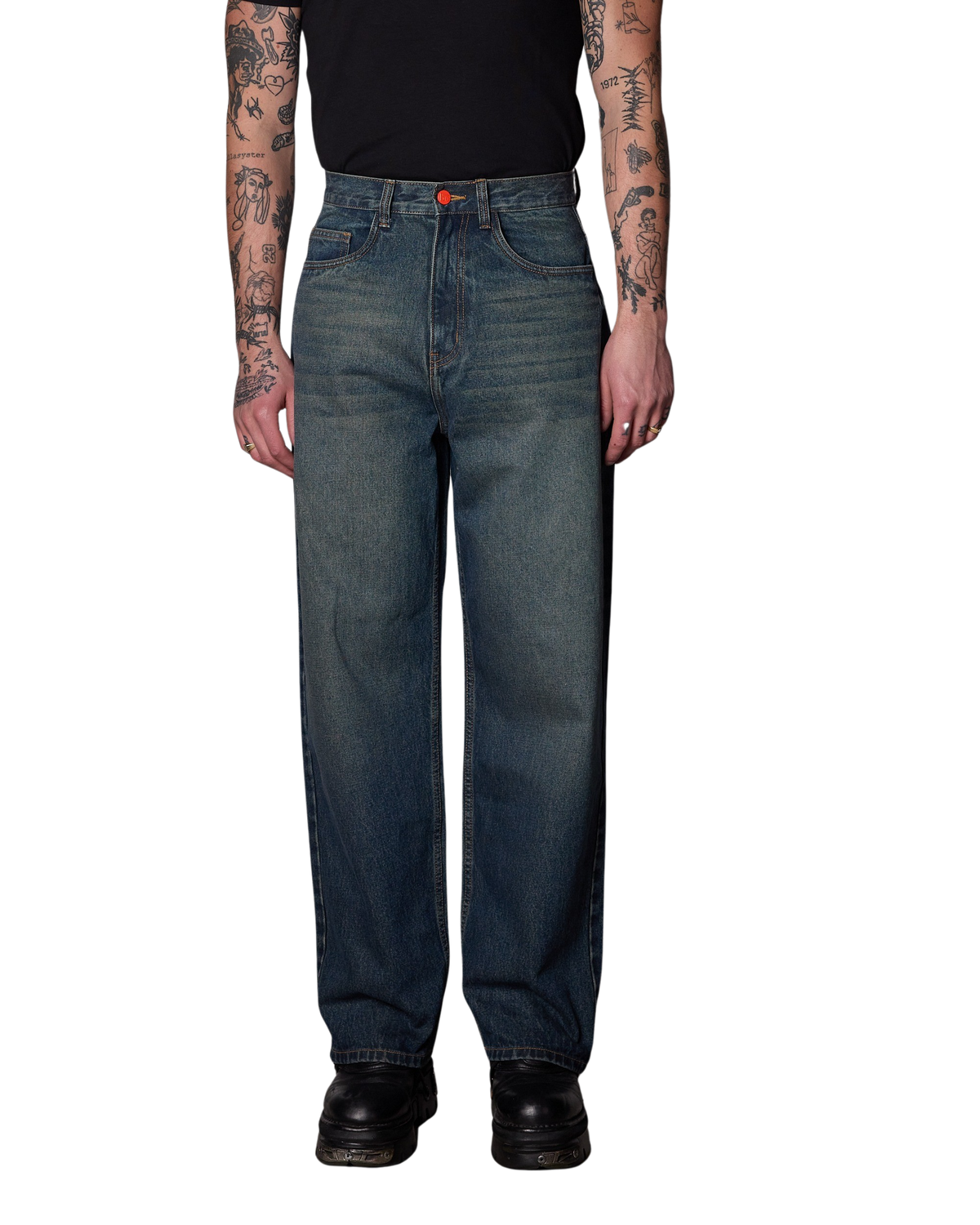 A person wearing a pair of BeWider Super Loose Blue Star Jeans.
They're a 2000's wash of denim featuring a yellow wash over the top of dark blue straight-leg denim jeans. , Paired with a black t-shirt and black boots, shown from the chest down on a white background. 