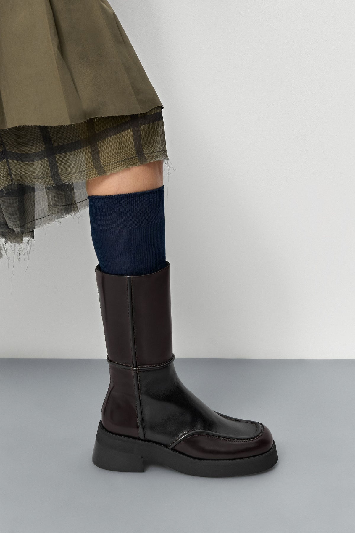 Miista E8 Inne brown leather boots styled with a navy knee-high sock