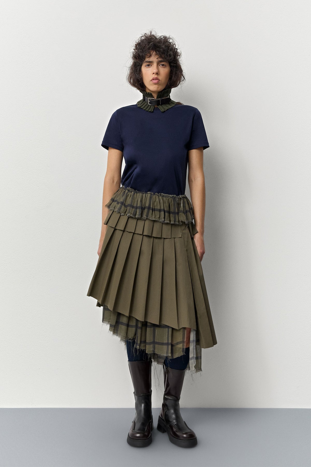 Miista E8 Inne brown leather boots worn with a navy top and green pleated skirt