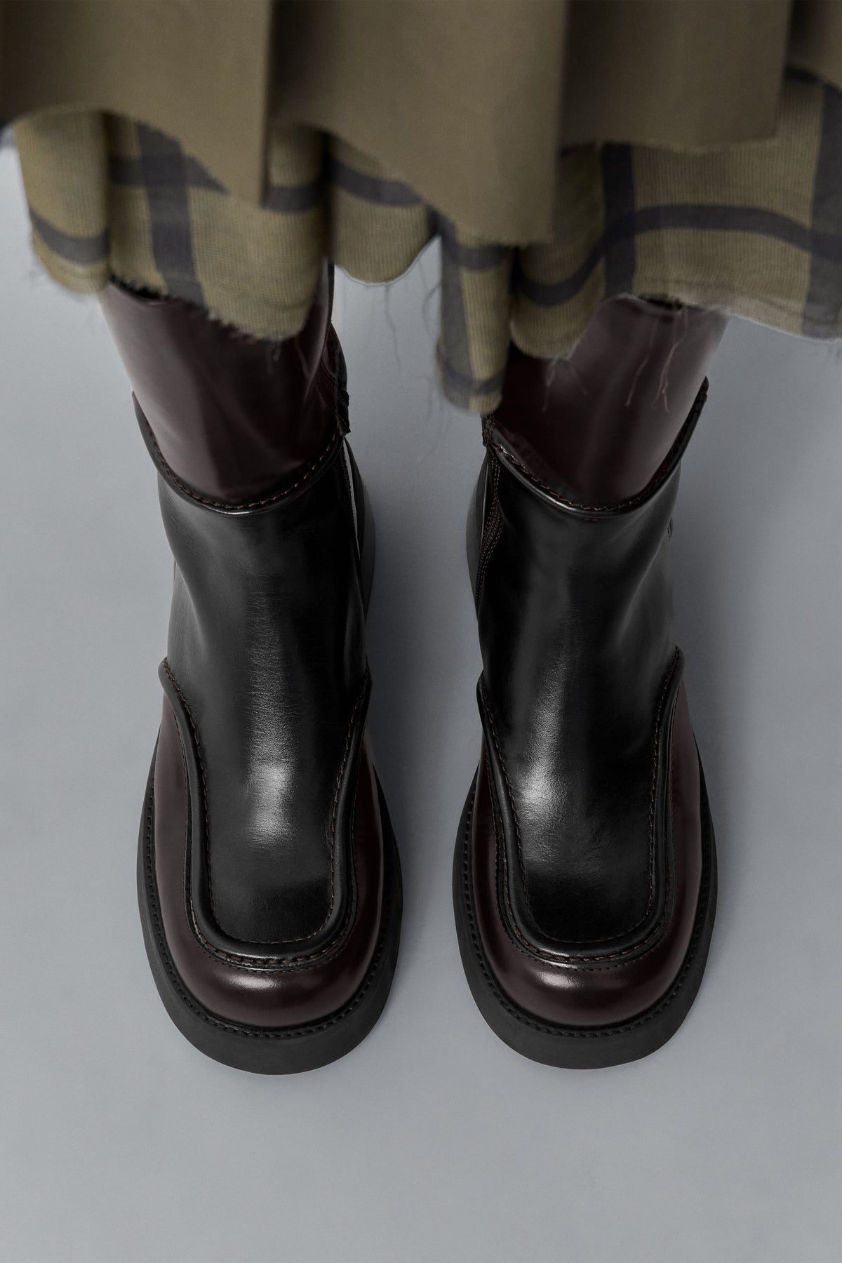 Miista E8 Inne dark brown leather boots worn with a plaid skirt