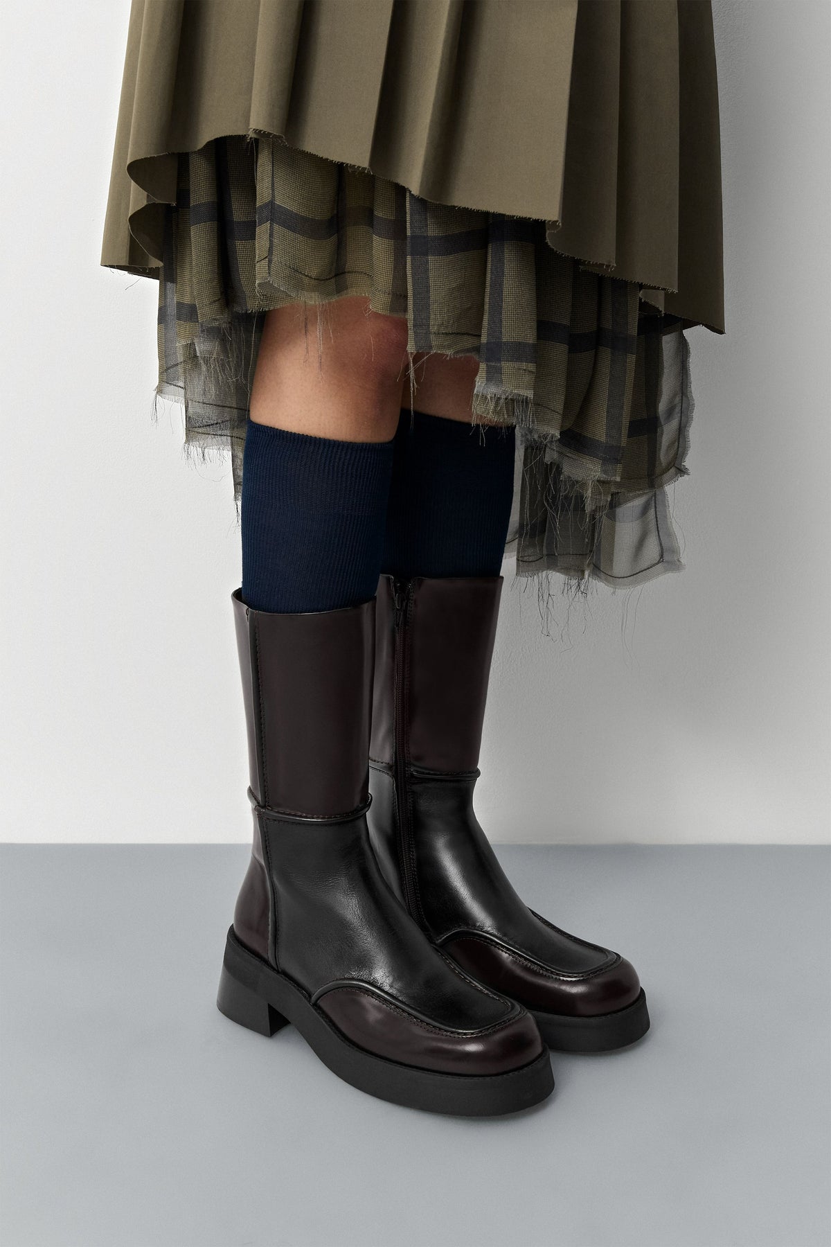 Miista E8 Inne dark brown leather boots worn with a skirt