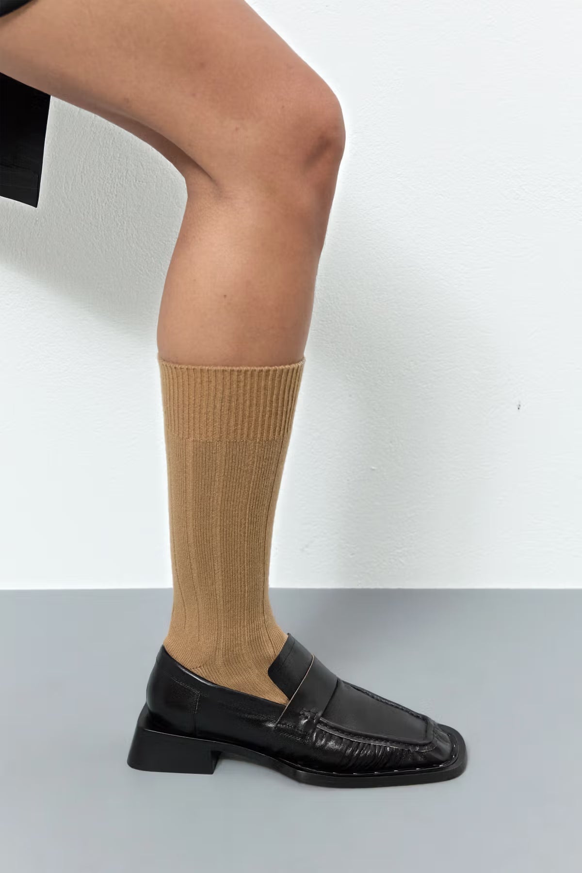 Black Miista Airi Loafer on foot with beige sock 