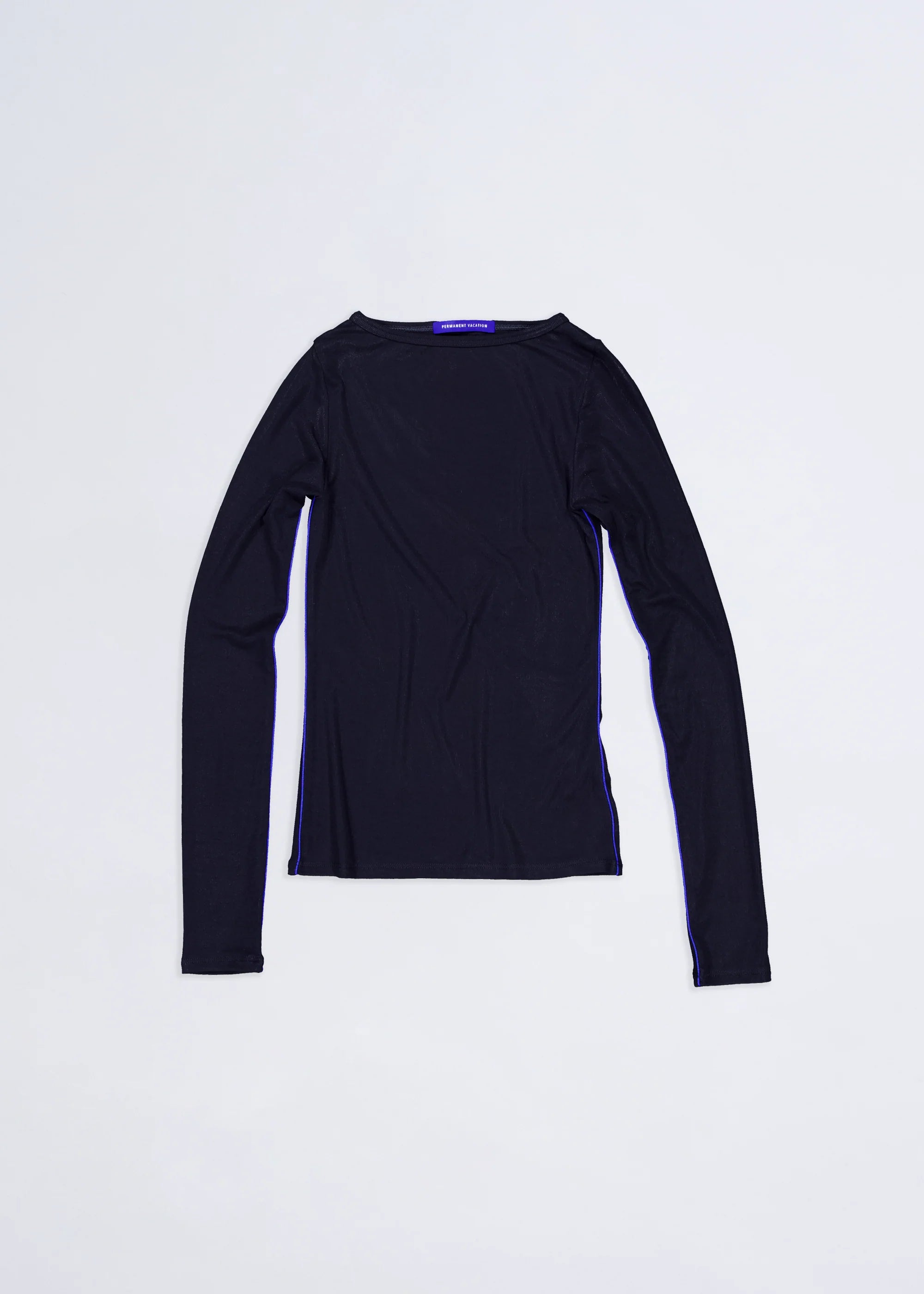 Flatlay of black permanent vacation orbit long sleeve top with blue piping on white background